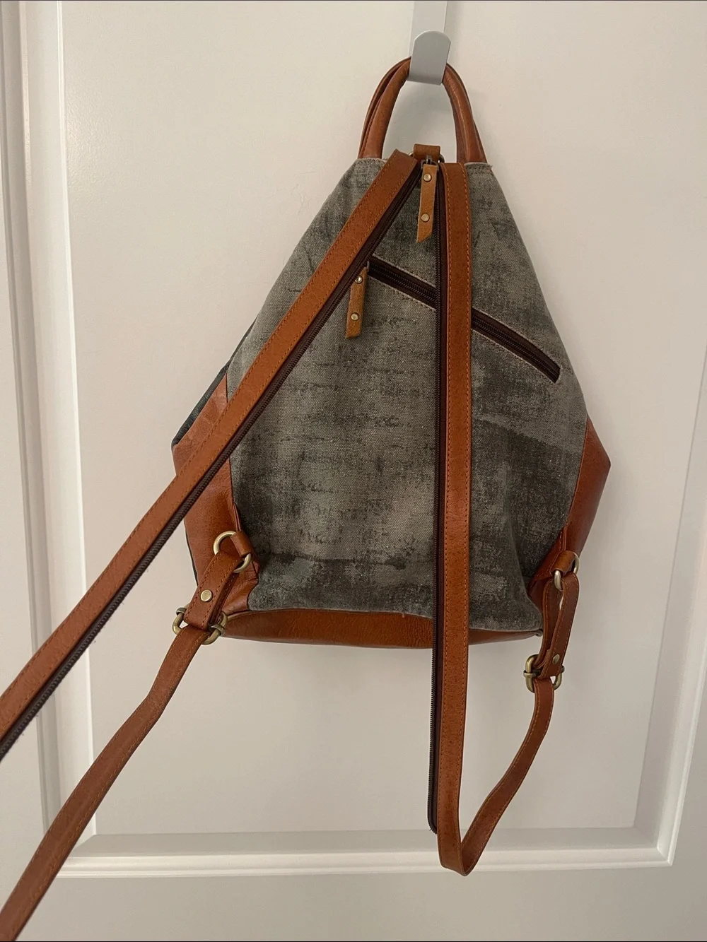 Black Leather Backpack with Brown Trim and Brass Accents